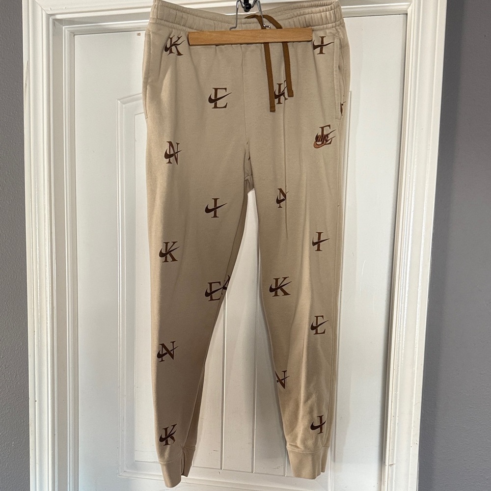Nike Beige Joggers with Logo Pattern